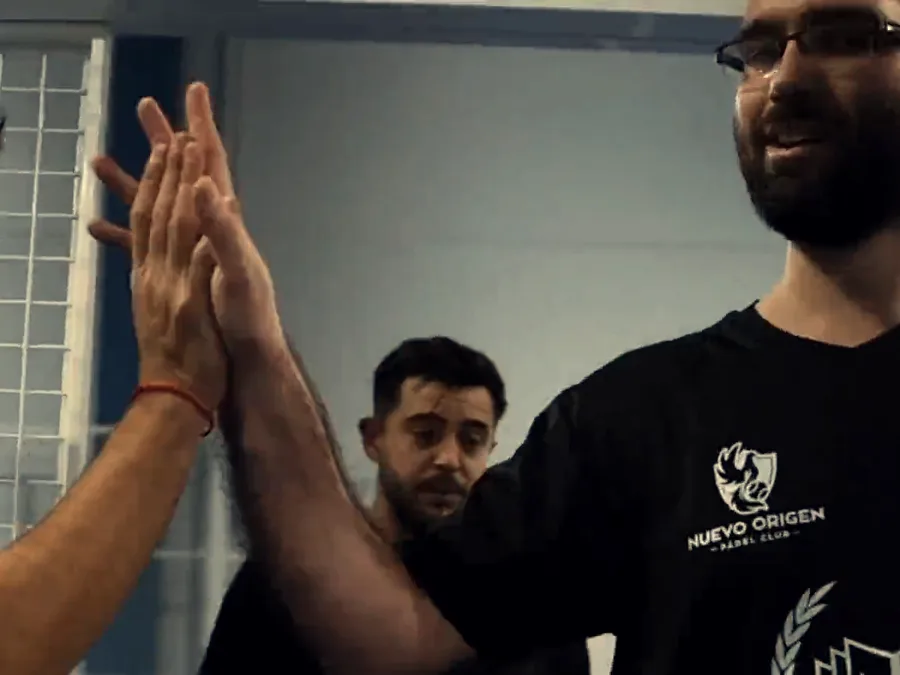 Two players high-five on court
