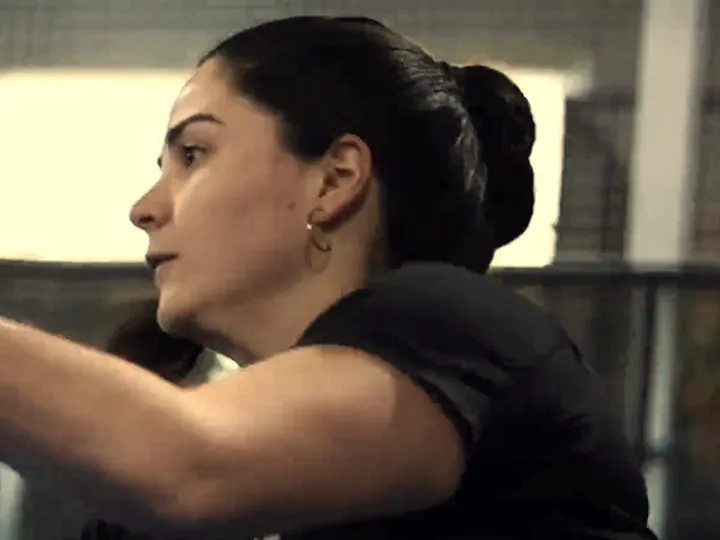 A player in profile, lit by the window
